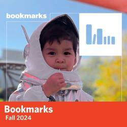 Bookmarks Fall 2024 - a child in an astronaut costume smiles at the camera while eating a lollipop